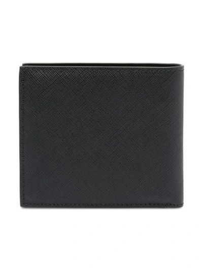 Shop Prada Logo Embossed Wallet In Black