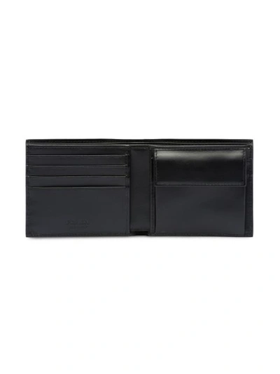 Shop Prada Logo Embossed Wallet In Black