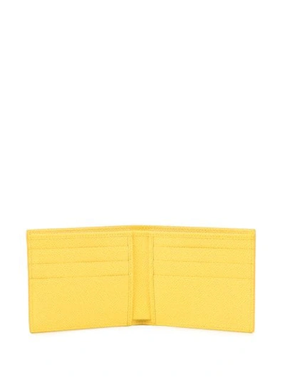 Shop Dolce & Gabbana Logo Plaque Bifold Wallet In Yellow