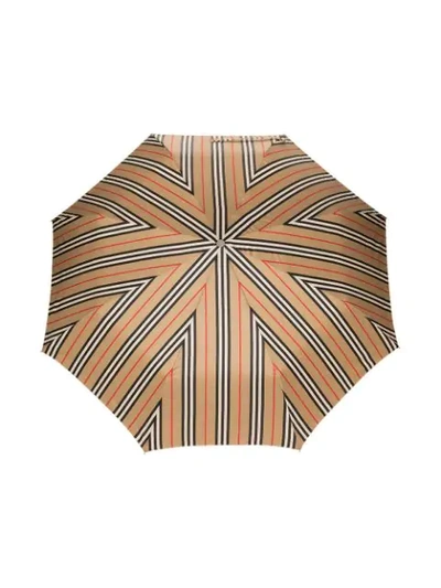 Shop Burberry Icon Stripe Folding Umbrella In 108 - Multicoloured