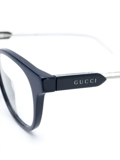 Shop Gucci Oval Frame Glasses In Blue