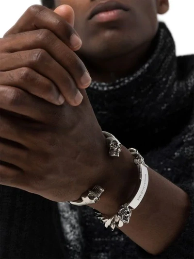 Shop Alexander Mcqueen Skulls Bracelet In Metallic