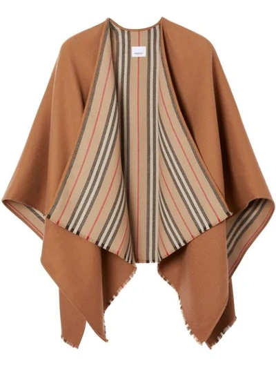 Shop Burberry Icon Stripe Detail Wool Cape In Brown