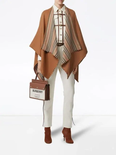 Shop Burberry Icon Stripe Detail Wool Cape In Brown