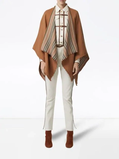 Shop Burberry Icon Stripe Detail Wool Cape In Brown