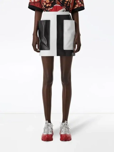 Shop Burberry Pocket Detail Two-tone Lambskin Mini Skirt In Black