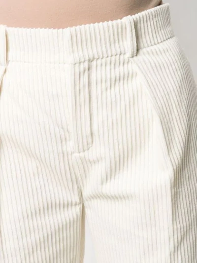 Shop Saint Laurent Tapered Corduroy Trousers In White