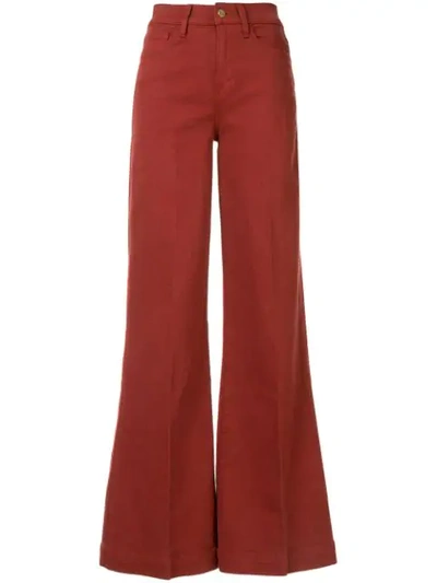 Shop Frame Wide-leg Flared Jeans In Red