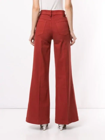 Shop Frame Wide-leg Flared Jeans In Red