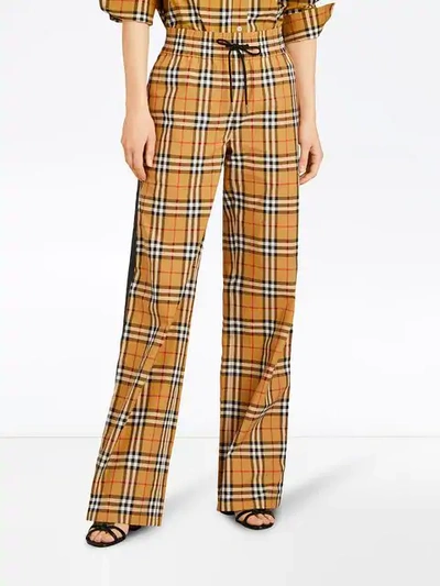 Shop Burberry Karierte Hose Mit Kordelzug In Yellow