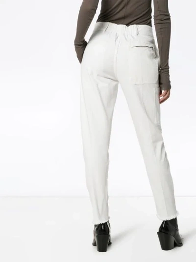 Shop Haider Ackermann Raw-hem Tapered Trousers In White