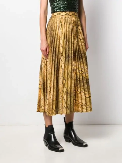 Shop Andamane Snakeskin Print Pleated Skirt In Yellow