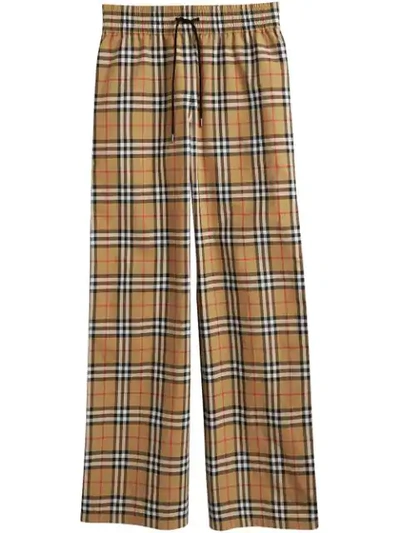 Shop Burberry Flared Checked Trousers - Multicolour
