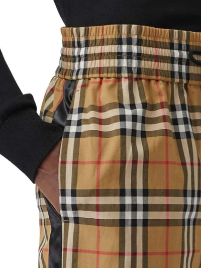 Shop Burberry Flared Checked Trousers - Multicolour