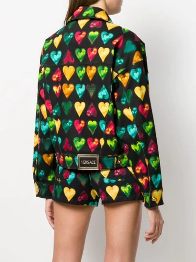 Shop Versace Heart Print Denim Jacket In Black
