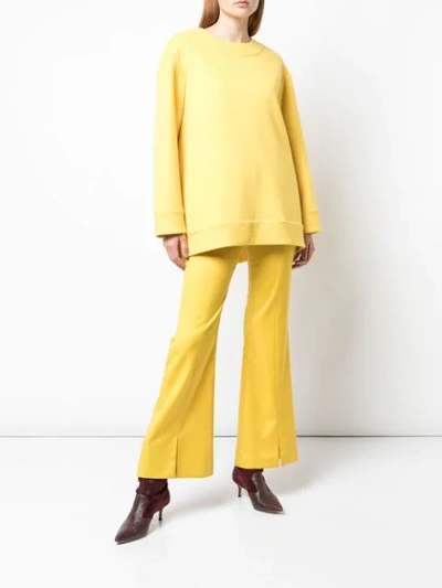 Shop Adam Lippes Flared Leg Trousers In Canary