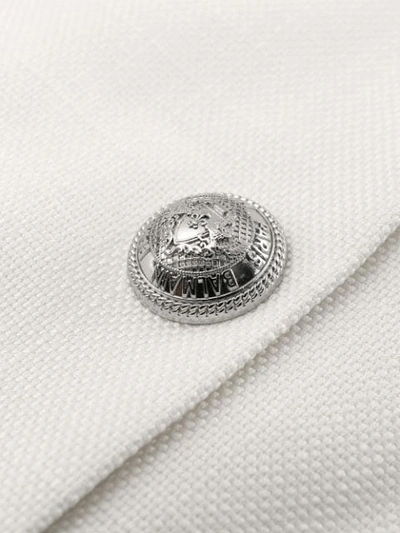Shop Balmain Embossed Buttons Mini Skirt In White
