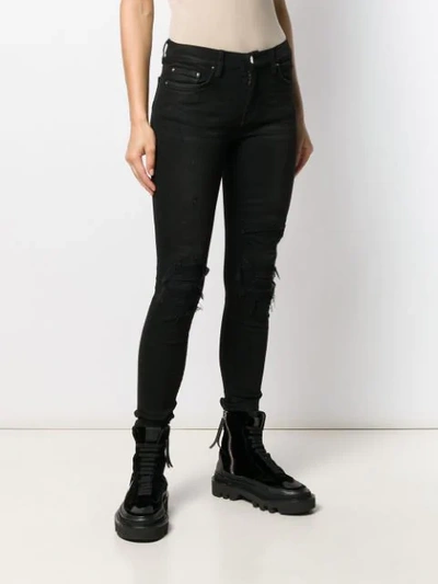 Shop Amiri Distressed Skinny Jeans In Black