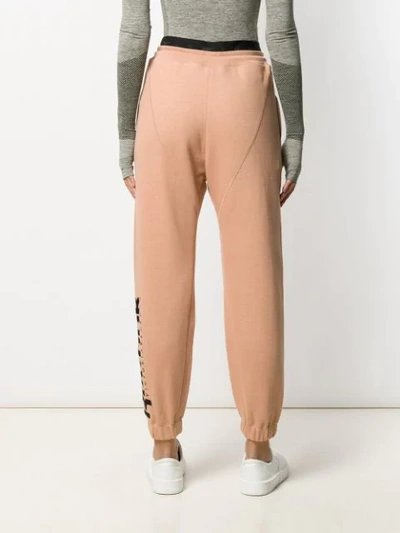 Shop Victoria Beckham Collaboration Logo Print Track Pants In Neutrals