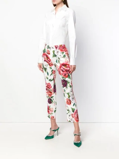 Shop Dolce & Gabbana Peony And Rose Print Trousers - White
