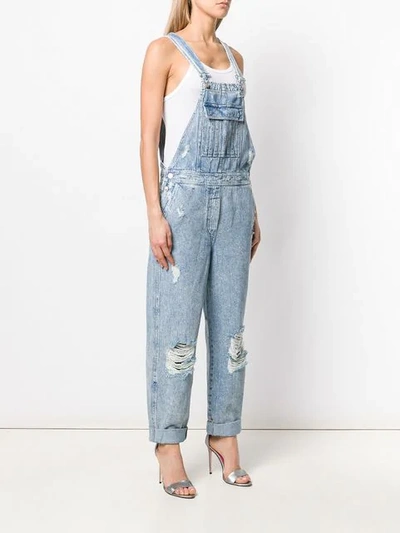 Shop Balmain Distressed Denim Jumpsuit In Blue