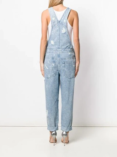 Shop Balmain Distressed Denim Jumpsuit In Blue