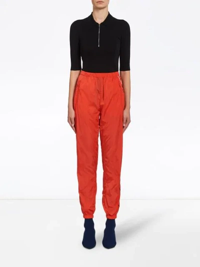 Shop Prada Logo Print Track Pants In Orange