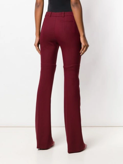 Shop Alexander Mcqueen Flared Tailored Trousers In Red
