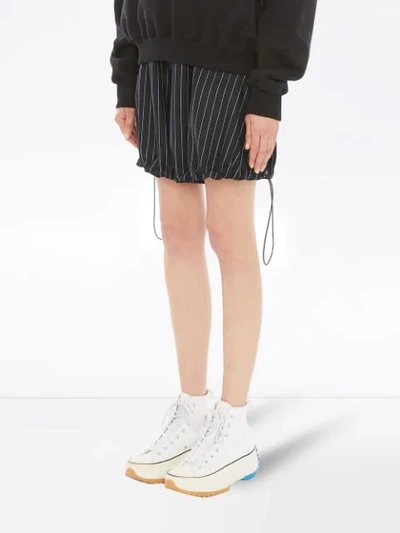 Shop Jw Anderson Pinstriped Balloon Shorts In Blue
