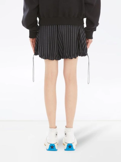 Shop Jw Anderson Pinstriped Balloon Shorts In Blue