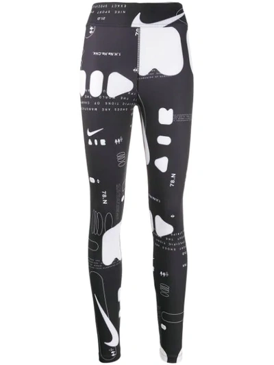 Shop Nike Graphic Print Leggings In Black