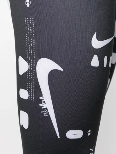 Shop Nike Graphic Print Leggings In Black