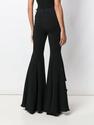 Shop Versace Ruffled Hem Flared Trousers In Black