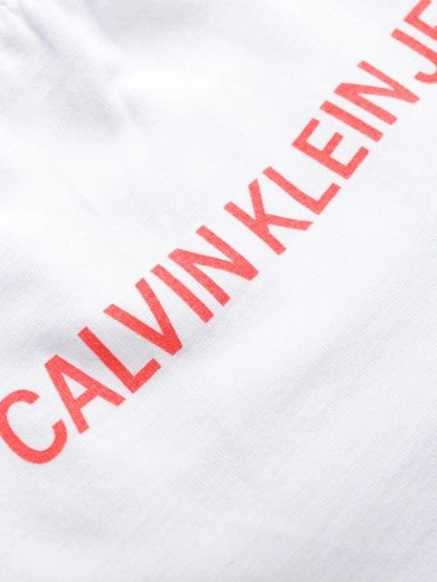 Shop Calvin Klein Jeans Est.1978 Bardot Logo Print Top In White