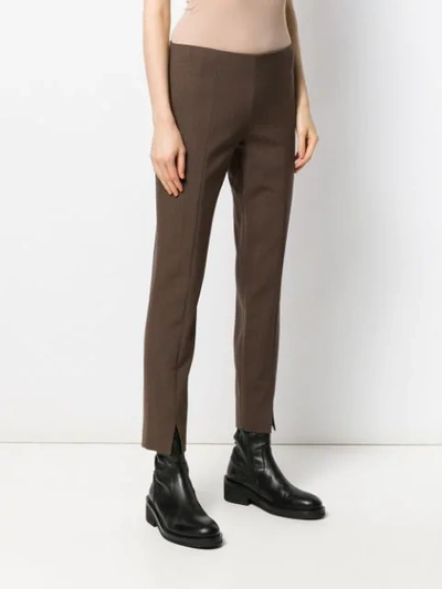 Shop The Row Skinny Fit Trousers In Brown
