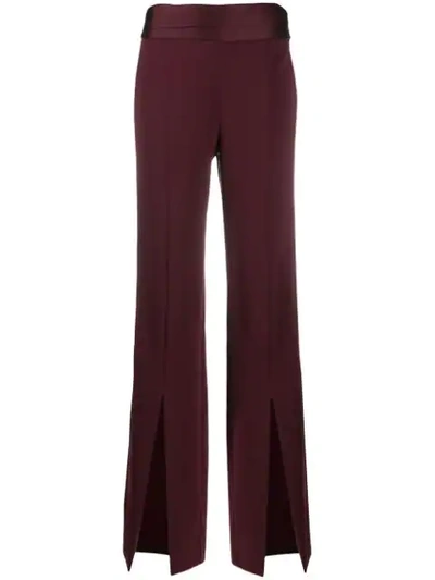 Shop Jonathan Simkhai Front Slit Flared Trousers In Red