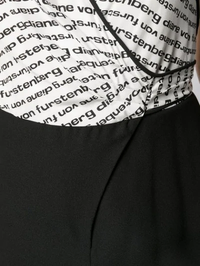 Shop Diane Von Furstenberg Logo Print Wrap Jumpsuit In Black