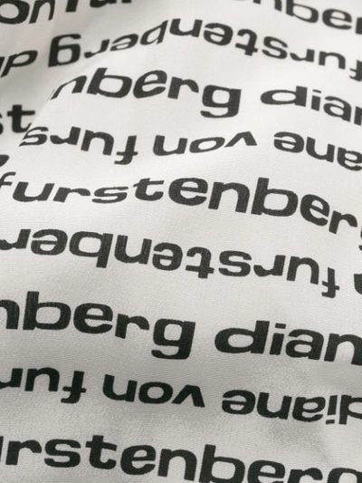 Shop Diane Von Furstenberg Logo Print Wrap Jumpsuit In Black