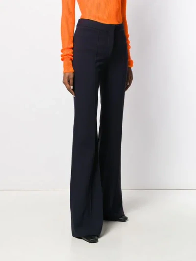 Shop Victoria Victoria Beckham Pin Tuck Flared Trousers In Blue