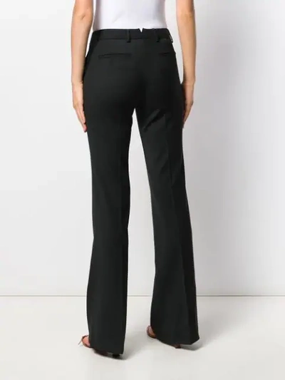 Shop Tonello Flared Style Trousers In 990 Black