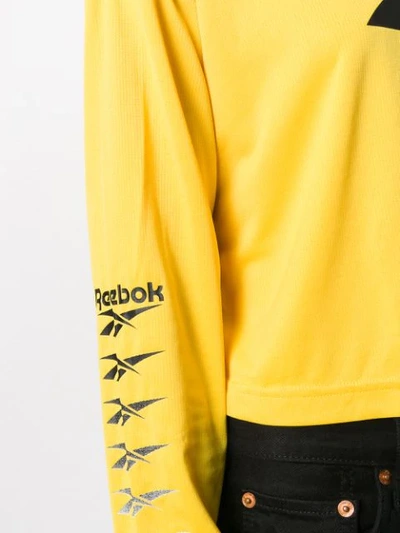 Shop Reebok Cropped Logo Top In Yellow
