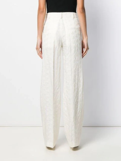 Shop Jacquemus Le Pantalon Moyo Trousers In White