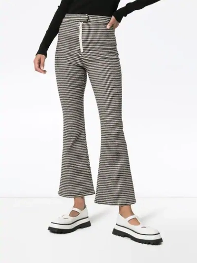 Shop Sandy Liang Check Print Flared Trousers In Black