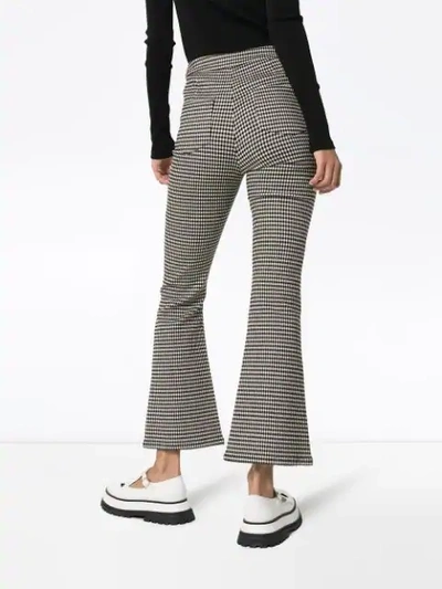 Shop Sandy Liang Check Print Flared Trousers In Black