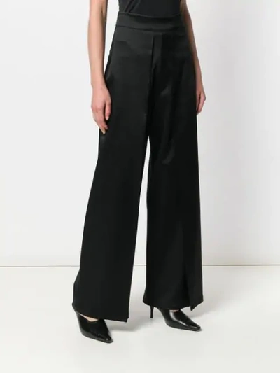pleat flared trousers