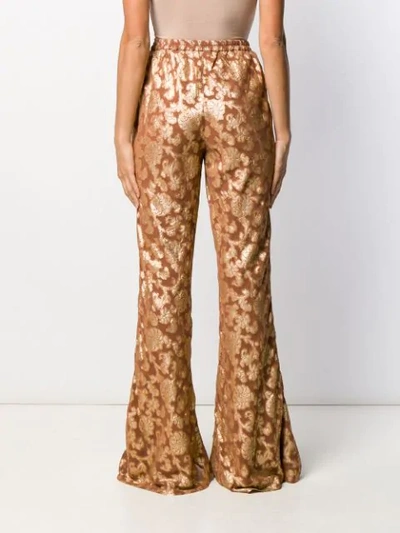 Shop Mes Demoiselles Floral Print Flared Trousers In Neutrals