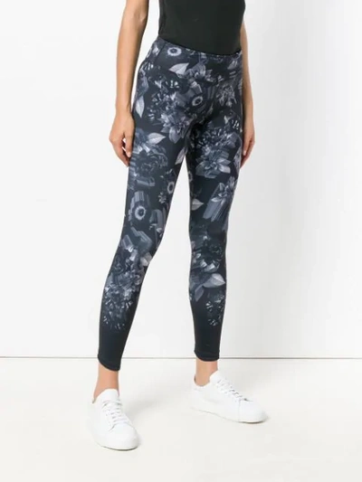 Shop Nike Floral Printed Leggings In Black