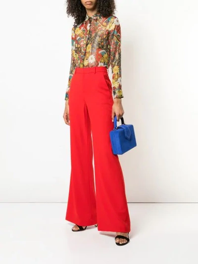 Shop Alice And Olivia High-rise Flared Trousers In Red