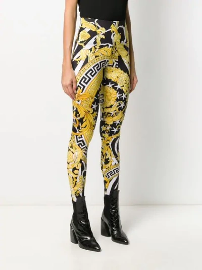 Shop Versace Graphic Leggings In Black