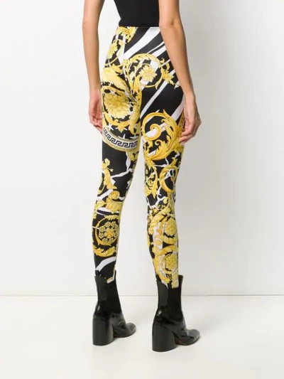 Shop Versace Graphic Leggings In Black